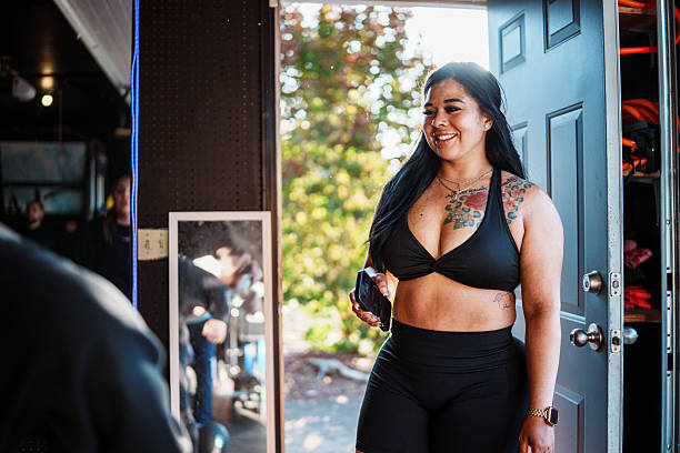 fitness instructor at work in gym she owns and operates