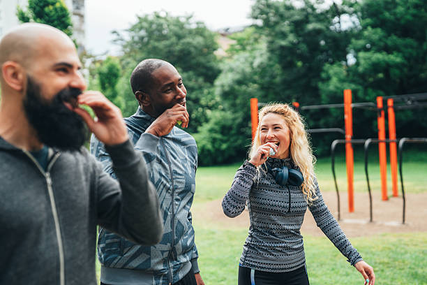 friends enjoying protein healthy snacks after outdoor workout